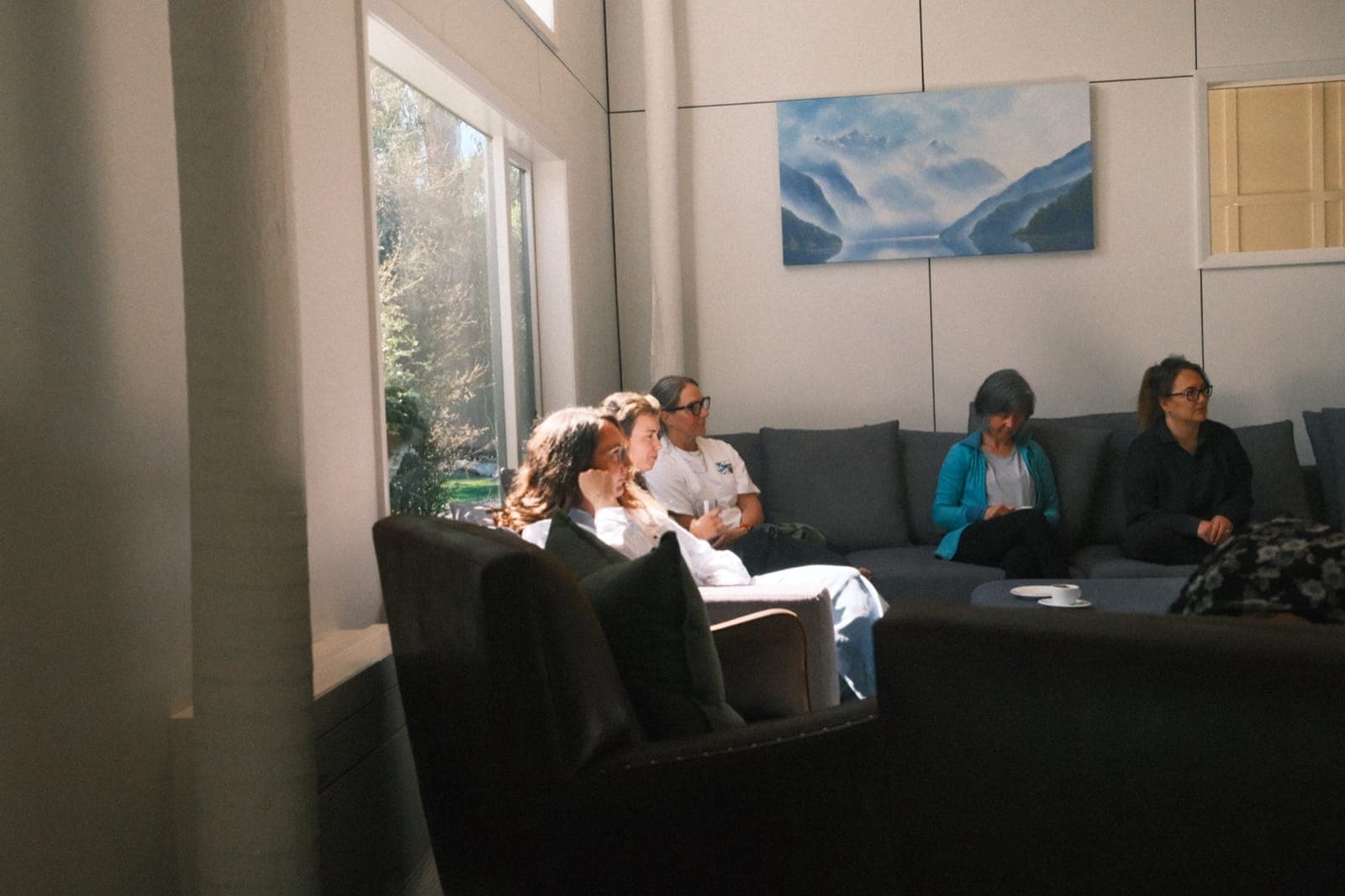 A breathwork session in progress, women lying in a circle in the studio